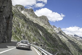 Photo with reduced saturation Porsche 911 GT3 on pass road of Sustenpass, Canton Uri, Switzerland,