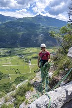 Climber on the rope, multi-pitch climbing, Via la Bellezza della Venere climbing tour, Garda