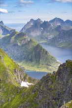 Mountain landscape with steep rocky peaks fjords and sea, view from the top of Munken to