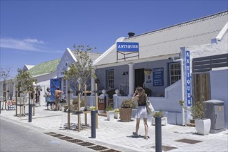 Western tourists at antiques shop in the main street of the town Hermanus, Overstrand, Overberg,