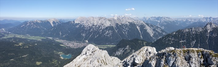 Aerial view, Alpine panorama, hikers at the summit cross, Westliche Wettersteinspitze, Wetterstein