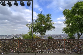 Love locks on the railing on Montmartre, view of Paris in the back, Pris, France, Europe