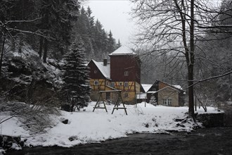 Historic Buschmühle Inn in the Kirnitzsch Valley in winter, Saxon Switzerland, Elbe Sandstone