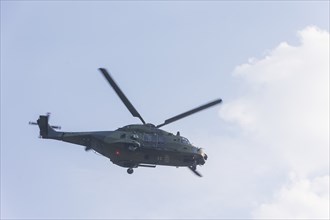 A Bundeswehr helicopter lands on the Elbe meadows in Bad Schandau on the Elbe, after a day of