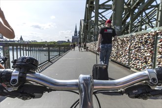 Cycling from a first-person perspective on a shared footpath and cycle path over the Hohenzollern