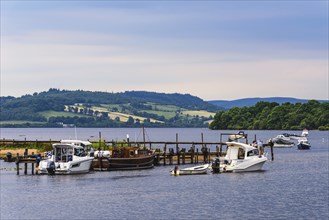 Boats in Balmaha at sunset, Loch Lamond, Scotland, UK