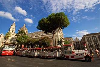 Super wide angle, cathedral, slow train, blue sky, white clouds, cathedral, Catania, old town,