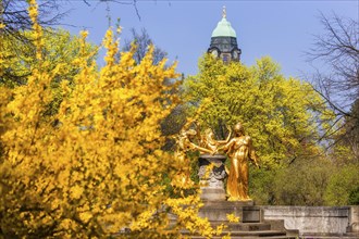 Bürgerwiese in Dresden in spring, Mozart Fountain with Town Hall Tower