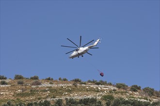 Helicopter, helicopter, fire-fighting helicopter, fire, helicopter flies over mountainside,