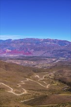 Winding road to the Cerro de 14 colores, Mountains of 14 Colours, Andes, Quebrada de Humahuaca,