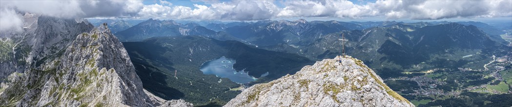 Aerial view, summit cross of the Waxenstein, Eibsee lake and Wetterstein mountains,