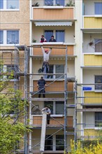 Dresden Plattenbau refurbishment in the Dresden Leubnitz area. Scaffolding in front of thermal