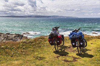 Two e-bikes on the South West Coast Path, coastline, conservation area, National Trust, Gwithian,