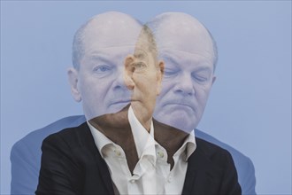 Photo taken as a double exposure. Olaf Scholz (SPD), Federal Chancellor, taken at a federal press