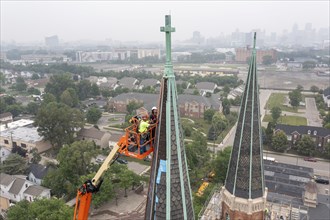 Detroit, Michigan, Workers repair the towers of the Basilica of Ste. Anne de Detroit. Ste. Anne was