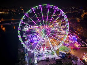 A 55m high illuminated Ferris wheel is the landmark of the fair at the Volksfest grounds on