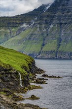 Waterfall into the ocean, Bordoy, Faroe islands, Denmark, Europe