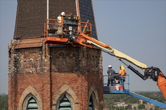 Detroit, Michigan, Workers repair the bell towers of the Basilica of Ste. Anne de Detroit. Ste.