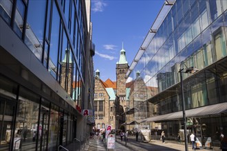 View through Bretgasse to the town hall with the reflection in Galeria Kaufhof