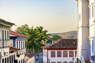 Historic center of the city of Diamantina with its colonial-style houses, hill and palm trees,