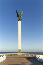 Sculpture of winged Mayan Angel on tall column, the seafront Malecon, Campeche city, Campeche