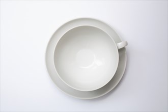 Tableware, empty teacup with saucer, seen from above