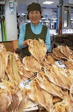 Korean market woman, 65, with dried grouper, Yeosu Fish Market, Yeosu, Jeollanam-do Province, South