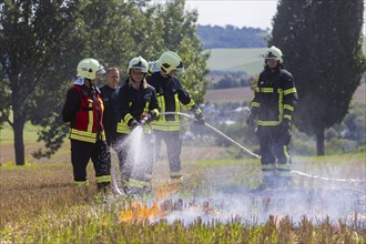 During controlled field fires, the firefighters were able to test various extinguishing methods,