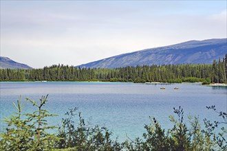 Transparent clear lake and small boats, Boya Provincial Park, Stewart Cessiar Highway, HW 37,