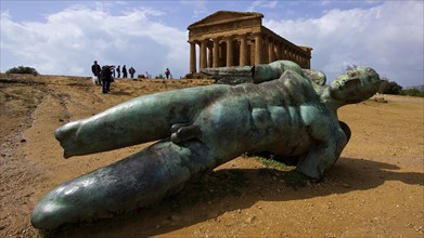 Super wide angle shot, bronze statue of fallen Icarus, Concordia Temple, Valley of the Temples,