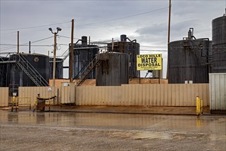 Loco Hills, New Mexico, Tanks hold produced water for disposal amid the oil wells of the Permian