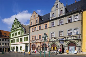 The square was given its distinctive shape in the 16th century by the town house and the