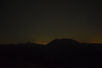 Silhouette of Watzmann and Grosser Hundstod at night in Berchtesgaden National Park, Bavaria,