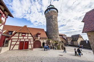 Imperial castle with Sinwelt tower, half-timbered houses in the castle, in autumn, Nuremberg,