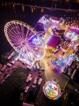 A 55m high illuminated Ferris wheel is the landmark of the fair at the Volksfest grounds on