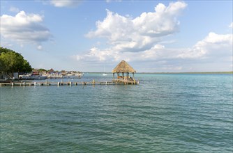 Cabana thatched cabin on wooden jetty Lake Bacalar, Bacalar, Quintana Roo, Yucatan Peninsula,