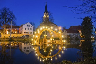 Floating candle arch in the village pond of Bärnsdorf near Moritzburg. The arch is 4.5m high,