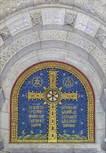 Cross mosaic in the tympanum with the quotation Eine feste Burg ist unser Glauben by Martin Luther,