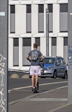 Tourists on electric scooters in inner-city traffic, Berlin, Germany, Europe