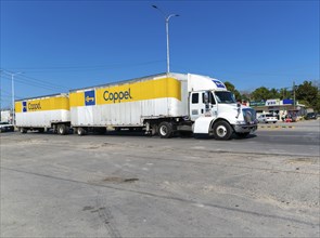 Vehicles road traffic on highway 307, Bacalar, Quintana Roo, Mexico Coppel articulated truck