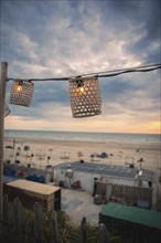 String of lights in the blue hour on the beach, Zandvoort, Netherlands