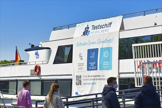 Heidelberg, Germany, April 2021: People waiting at Corona virus test station called 'Testschiff' on