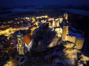 Castle and town of Stolpen on a winter evening