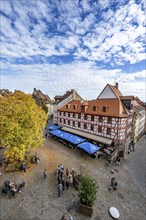 Square at the Tiergärtnertor with half-timbered houses, by the Kaiserburg, in autumn, Old Town,