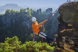 Climbers in Rathen in Saxon Switzerland