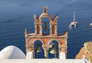 Old belfry wiith yacht and blue sea, Ia, Oia, Santorini, Greece, Europe