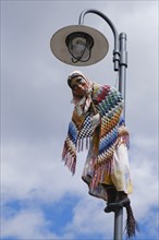 Figure of a witch hanging from a streetlamp, Walpurgis Night, St. Andreasberg, Lower Saxony,