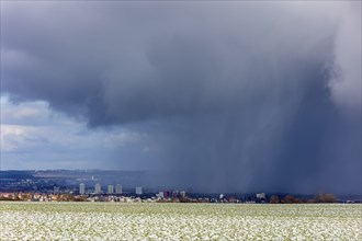 A snow shower moves through the Elbe valley towards the city centre of Dresden