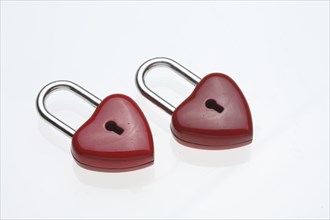 Two small red padlocks