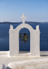 Whitewashed belfry wiith view of caldera and sea, Ia, Oia, Santorini, Greece, Europe